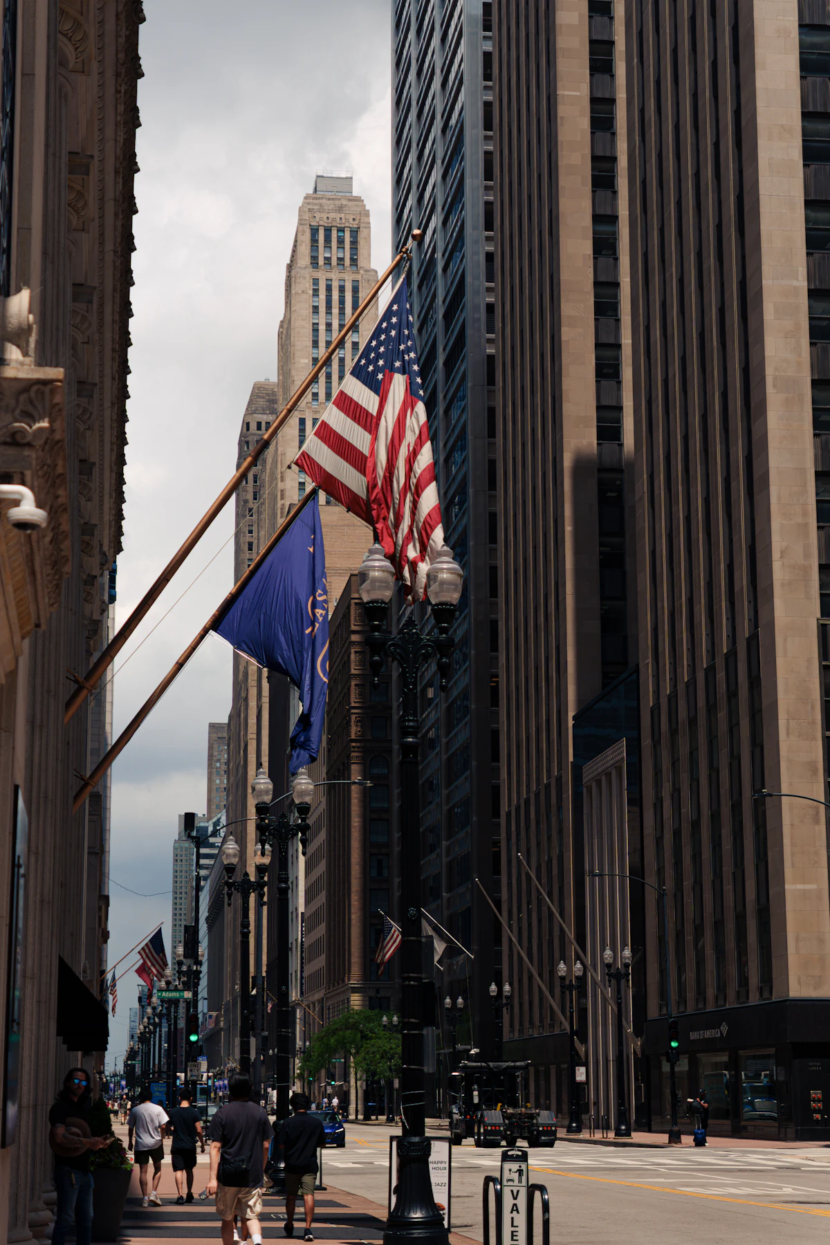 American flags flying on a downtown city street